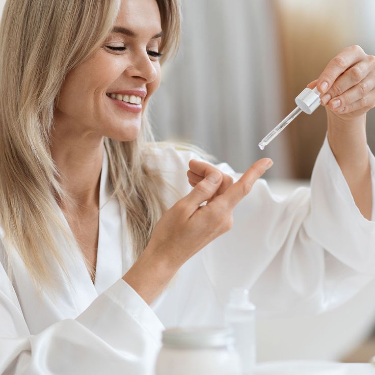 skincare girl applying a serum